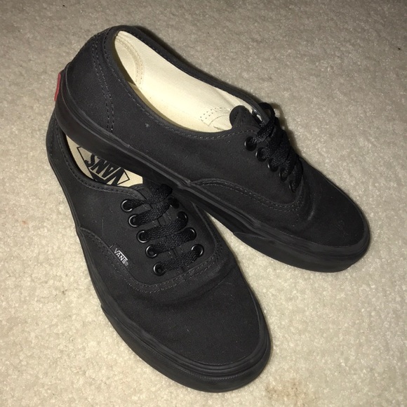 all black low top vans